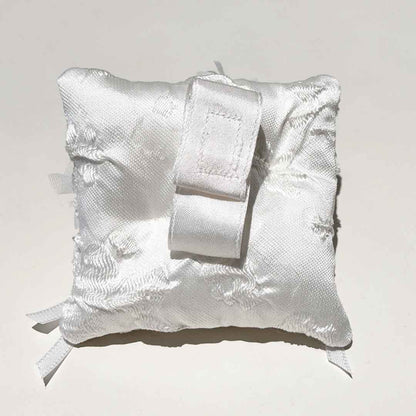 The back of this Dog Ring Bearer Cushion is just as exquisite as the front, featuring a soft, durable fabric designed for both comfort and style. Carefully crafted with attention to detail, it ensures that your furry friend will carry the cushion with ease, while adding an extra touch of elegance to the overall design. Perfectly tailored for your pet's role as a ring bearer, it’s a beautiful blend of functionality and sophistication.