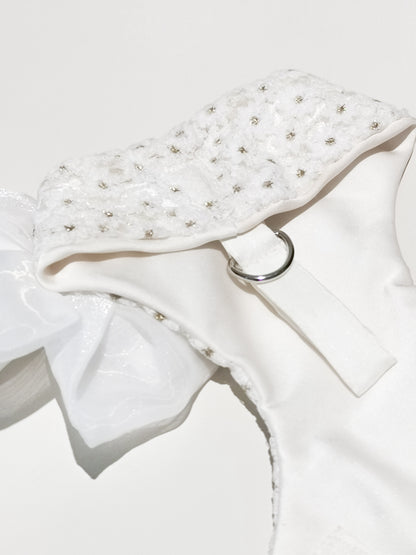 in the photo the back part of the white dog wedding harness with daisies and D-hook for the leash